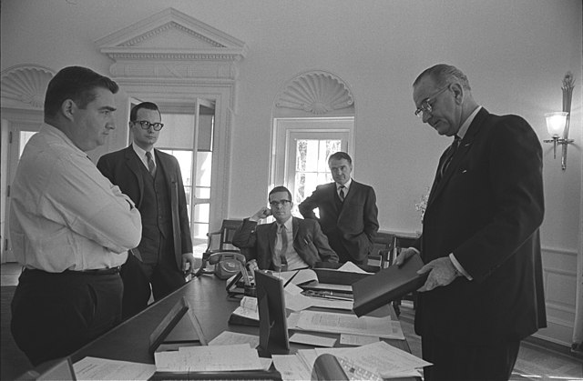 L-R: Pierre Salinger, Bill Moyers, Ted Sorensen, Jack Valenti, President Lyndon B. Johnson